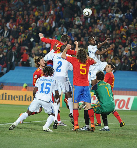 Spain's striker Fernando Torres (C, L) heads the ball during the Group H first round 2010 World Cup football match Spain vs. Honduras on June 21, 2010 at Ellis Park stadium in Johannesburg.